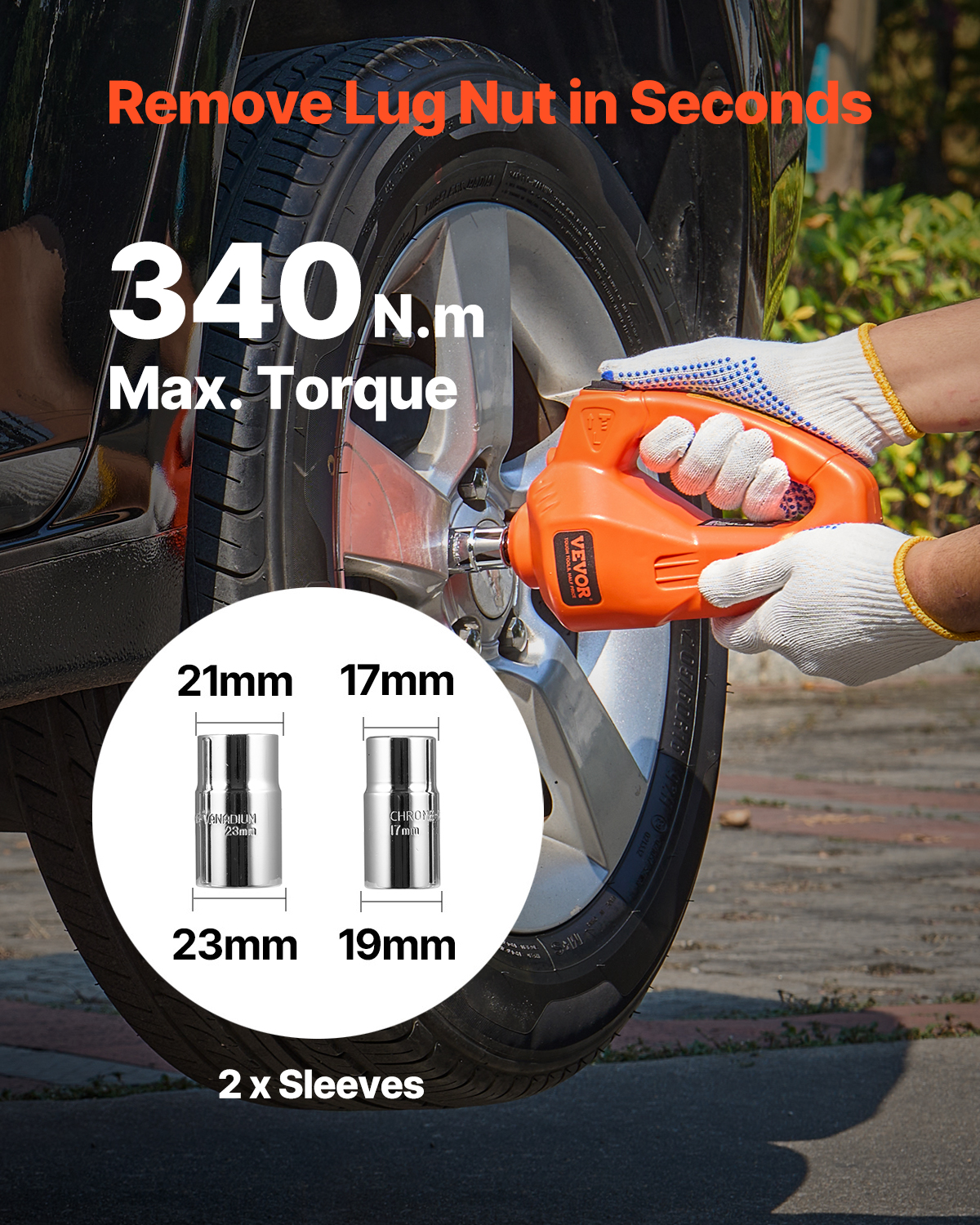 Una persona con guantes usa una llave de impacto naranja en la rueda de un auto.