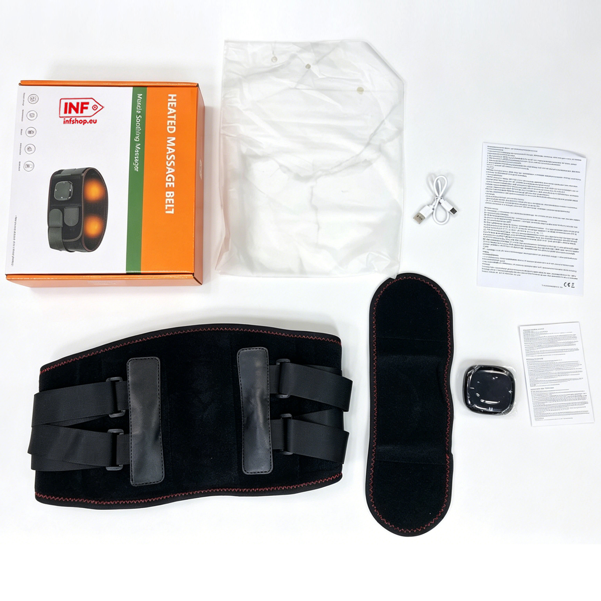 Beheizter Massagegürtel mit Verpackung, Zubehör und Handbuch auf weißem Tisch.