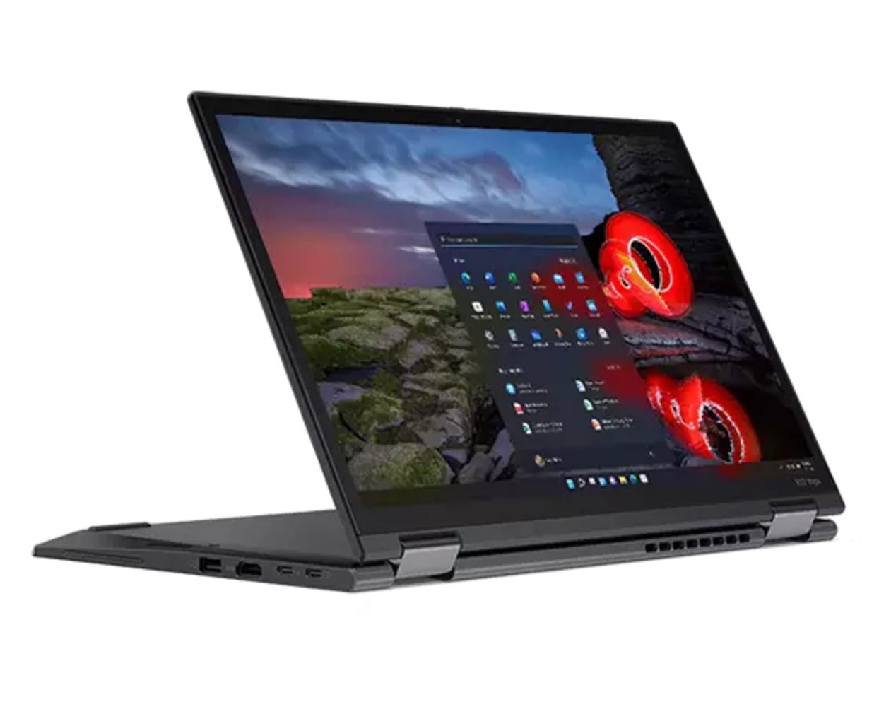 Ein schwarzer Laptop vor dunklem Hintergrund zeigt das Startmenü auf dem Bildschirm.
