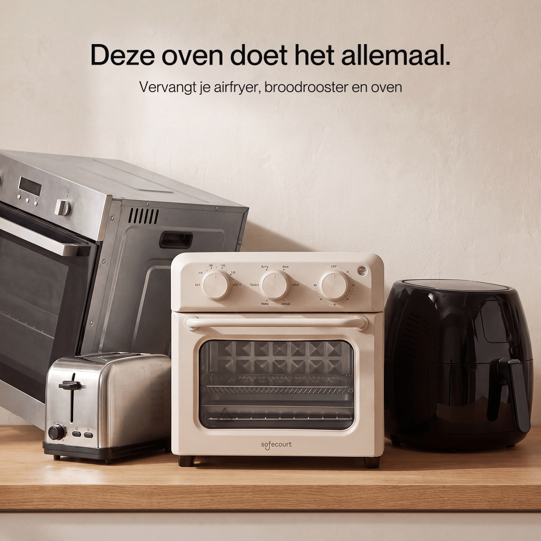 A cream mini oven, toaster, and air fryer on a wooden counter against a beige wall, with Dutch text above.