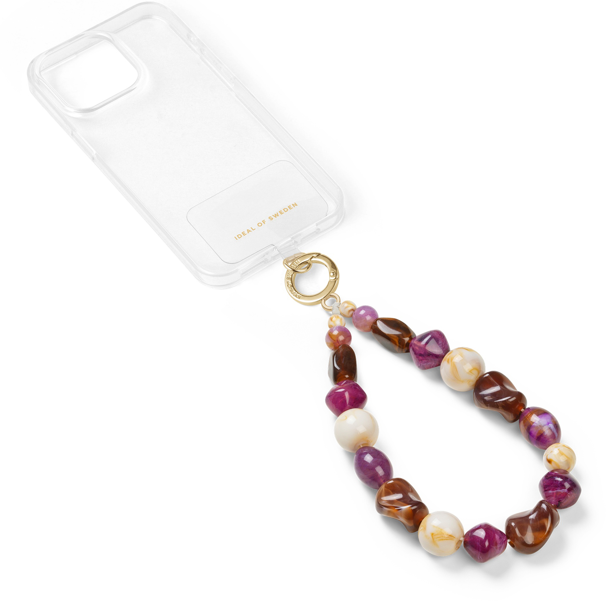 Eine transparente Handyhülle mit einer Schlaufe aus lila, braunen und cremefarbenen Perlen und einem Goldring.