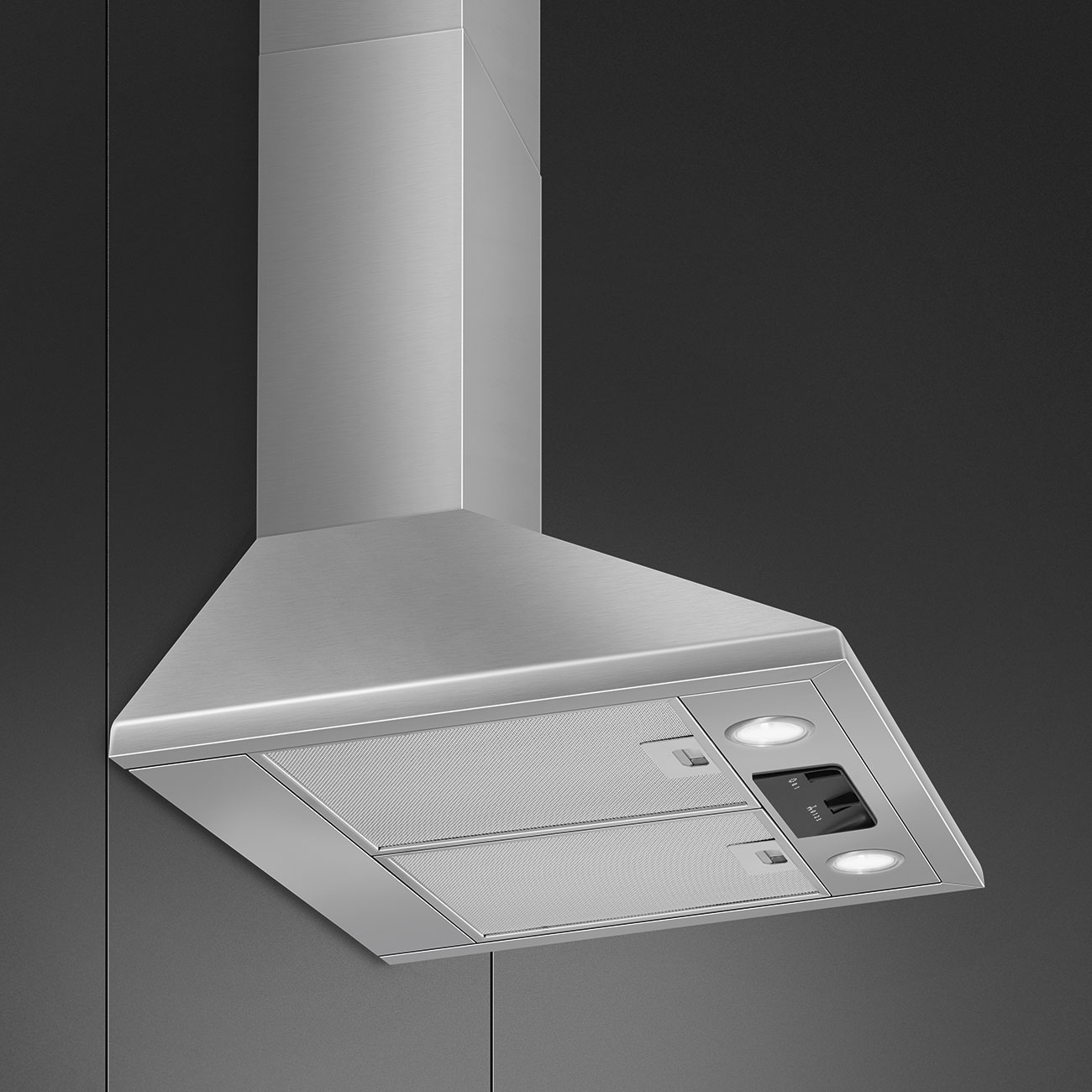 Una moderna campana extractora de acero inoxidable sobre fondo oscuro con luces integradas.