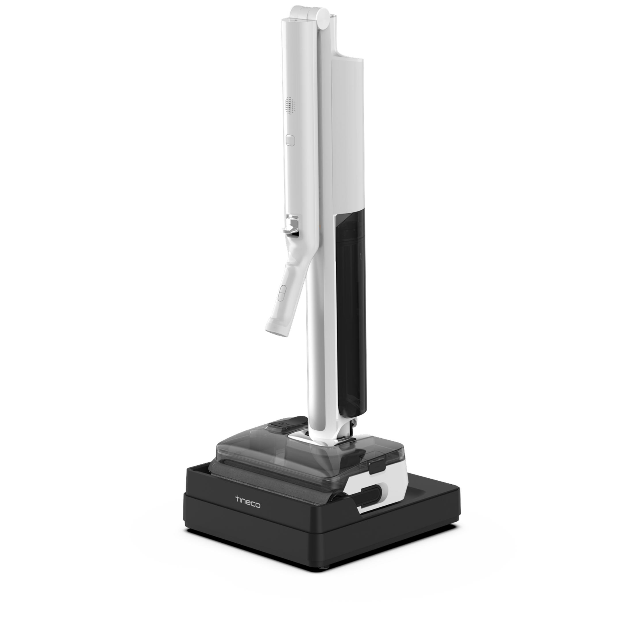 Un aspirateur balai sans fil Tineco blanc et noir est installé sur sa station de charge sur fond blanc.