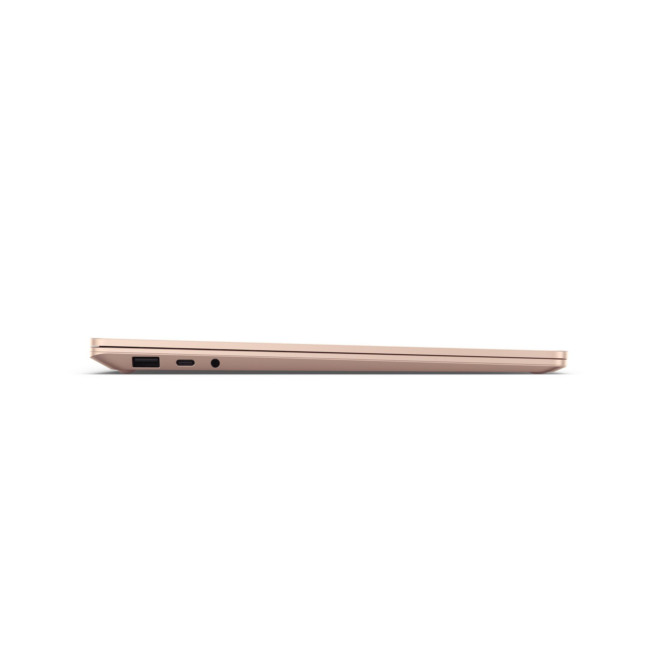 Seitenansicht eines schlanken, roségoldenen Laptops mit sichtbaren Anschlüssen.