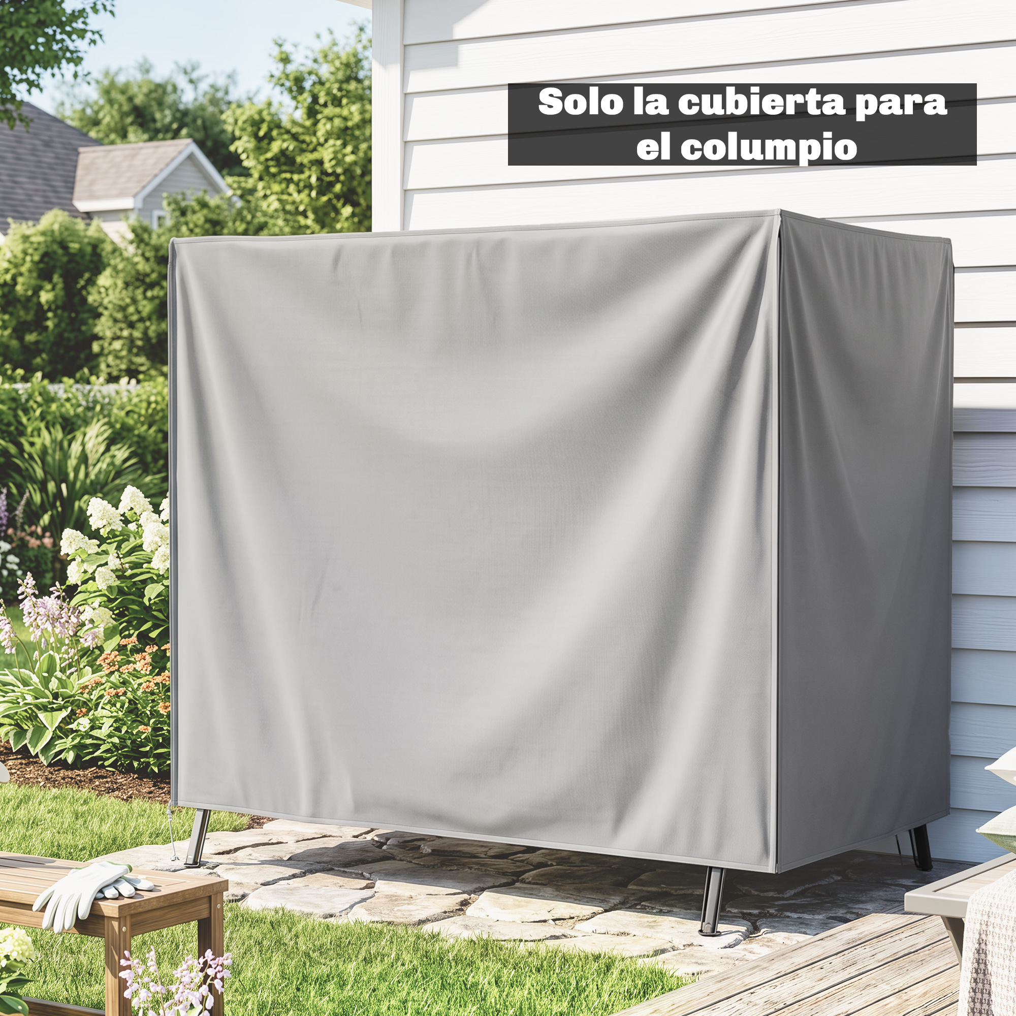Una funda protectora gris para columpio en un patio de piedra frente a una casa blanca.