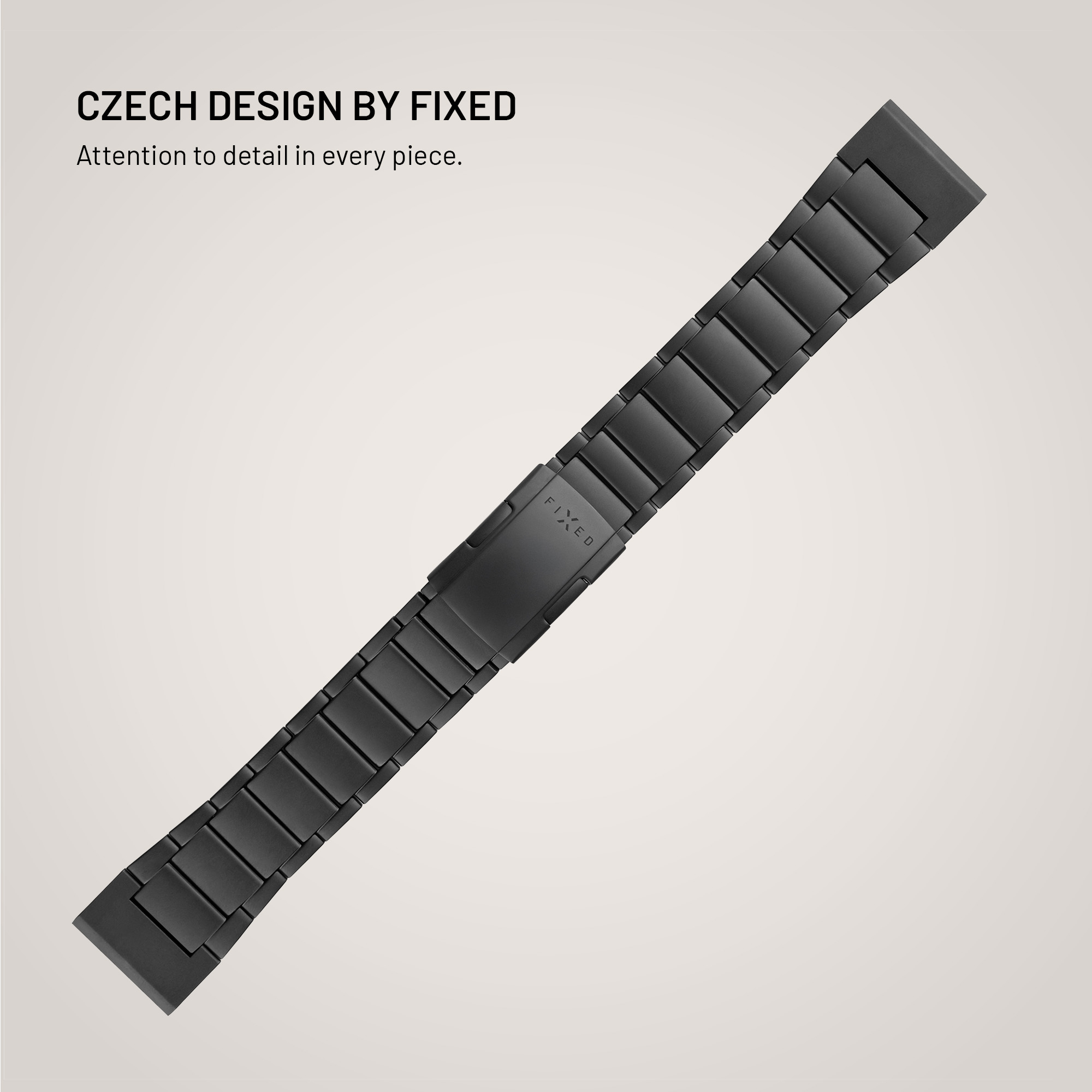 Ein schwarzes Metall-Uhrenarmband diagonal platziert vor hellem Hintergrund mit Text.