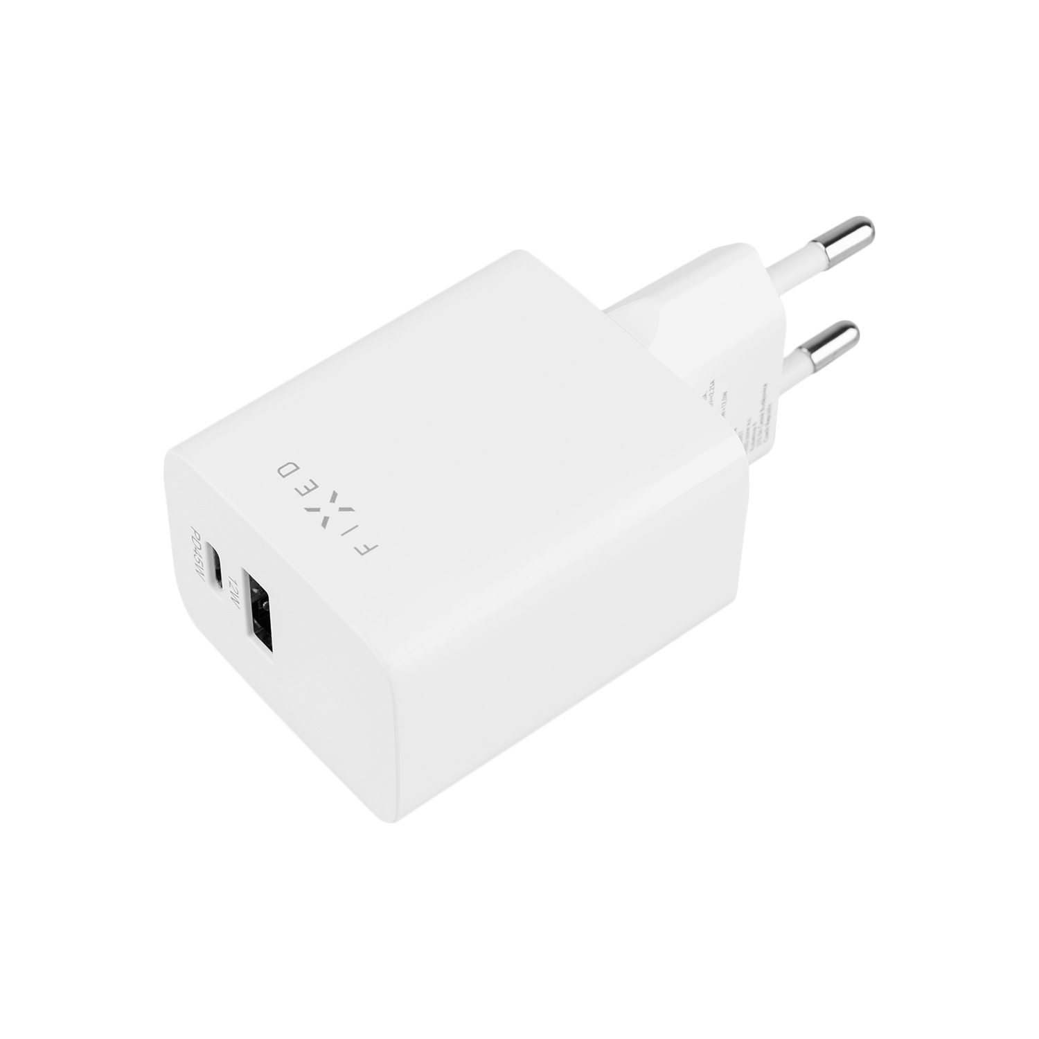 Ein weißes USB-Netzteil mit zwei Anschlüssen und der Aufschrift FIXED liegt auf weißem Hintergrund.