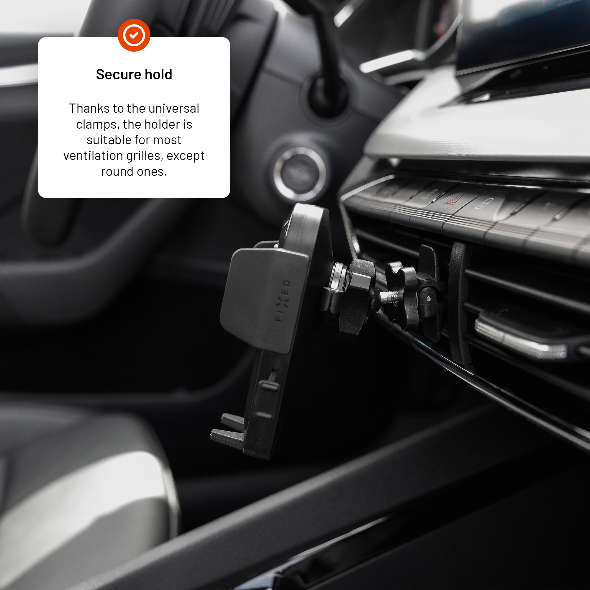 Ein schwarzer Handyhalter am Lüftungsgitter eines Autos mit Textfeld.