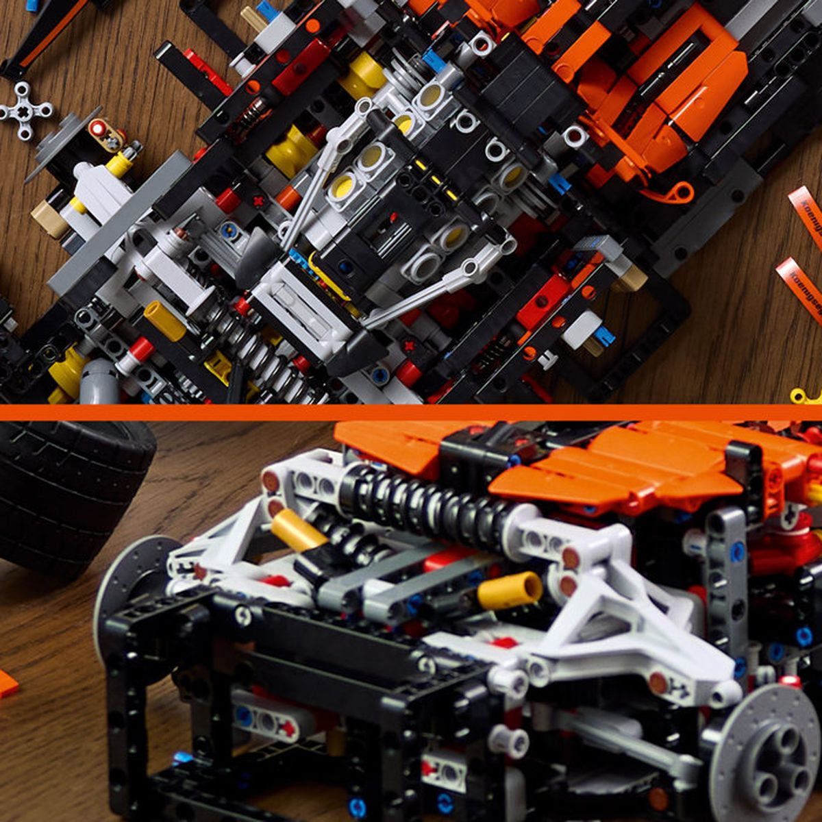 Chasis de auto Lego Technic detallado con paneles naranjas, suspensión y piezas de motor en suelo de madera.
