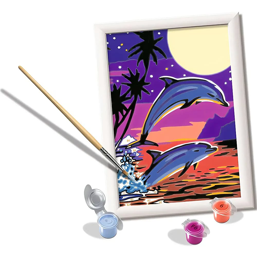 Un kit de pintura por números muestra dos delfines saltando al atardecer junto a palmeras, con pincel y pinturas.