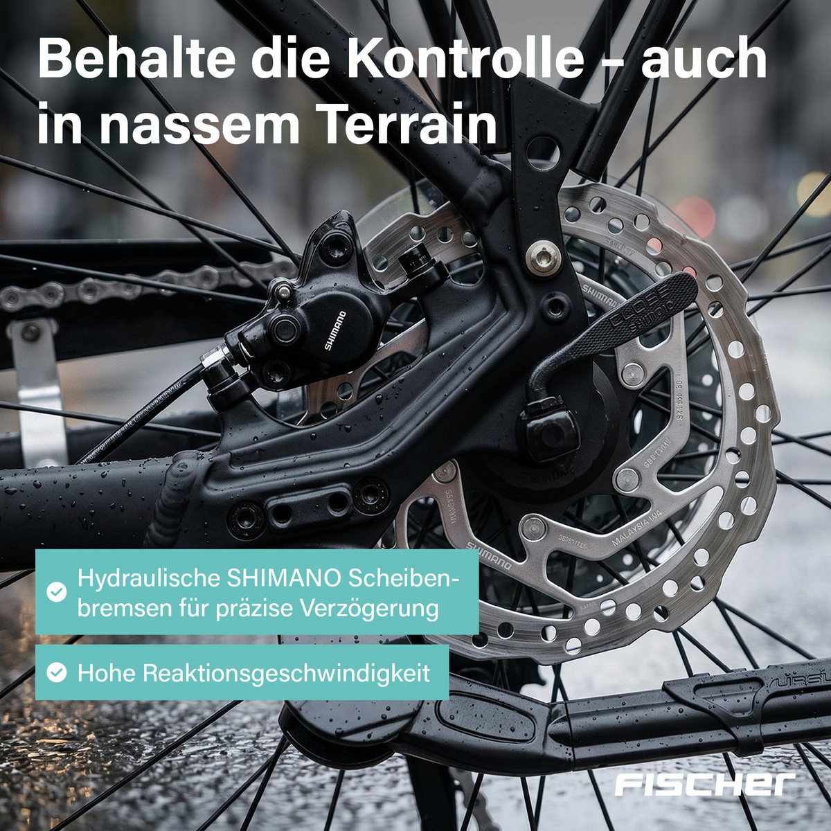 Nahaufnahme einer schwarzen Shimano hydraulischen Scheibenbremse und nassem Rahmen eines Fahrrads.