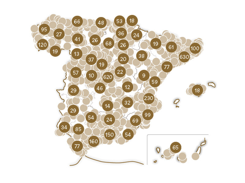 Mapa de España cubierto de numerosos círculos marrones y marrón claro, algunos con números.