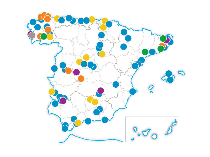 Mapa de España con marcadores circulares de colores distribuidos por varias regiones e islas.