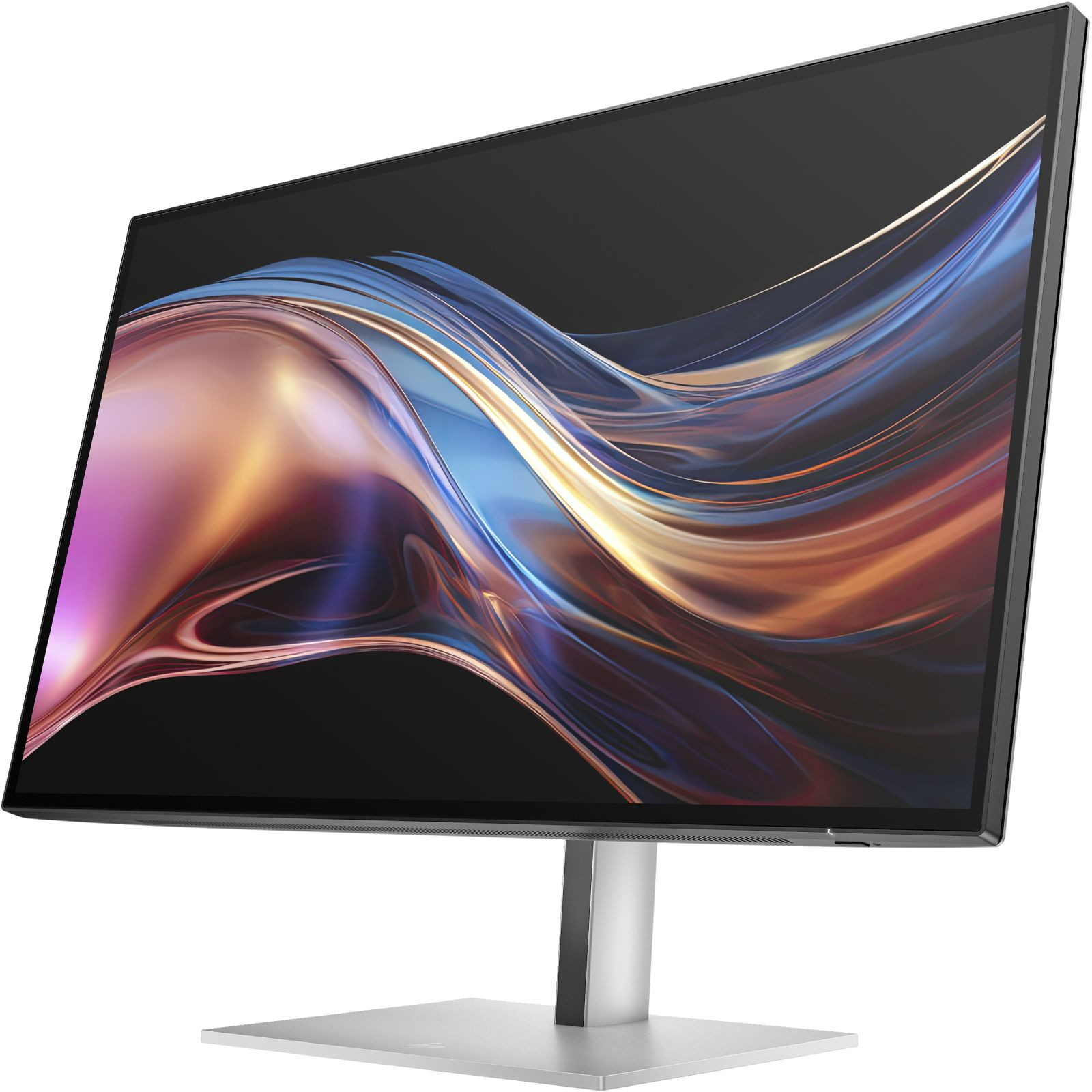 Un elegante monitor che mostra un motivo a onde astratte e colorate poggia su un supporto argentato.