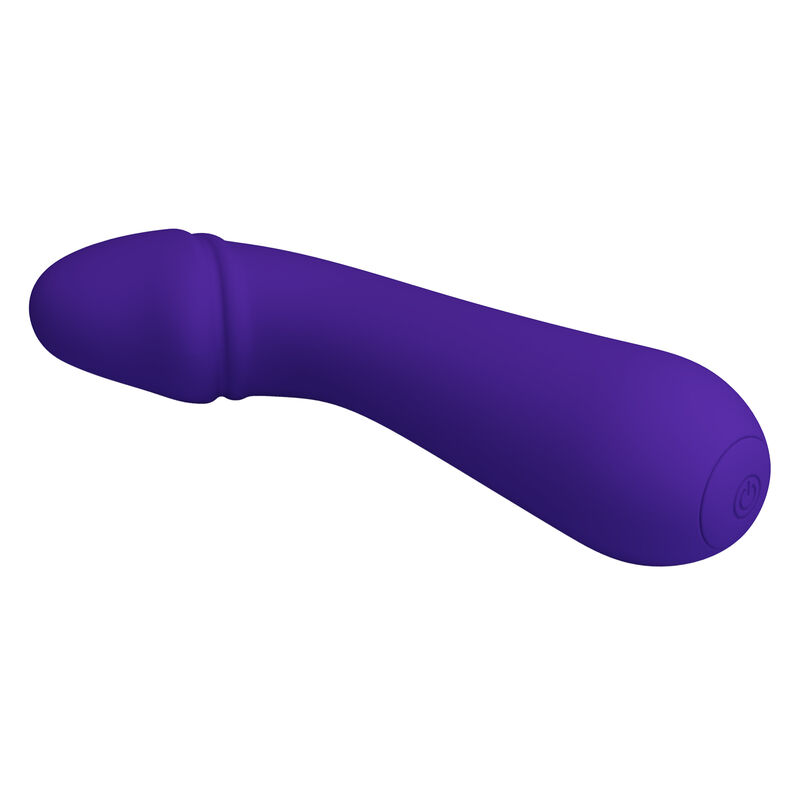Vibrador de color morado y forma ergon#mica sobre fondo blanco.