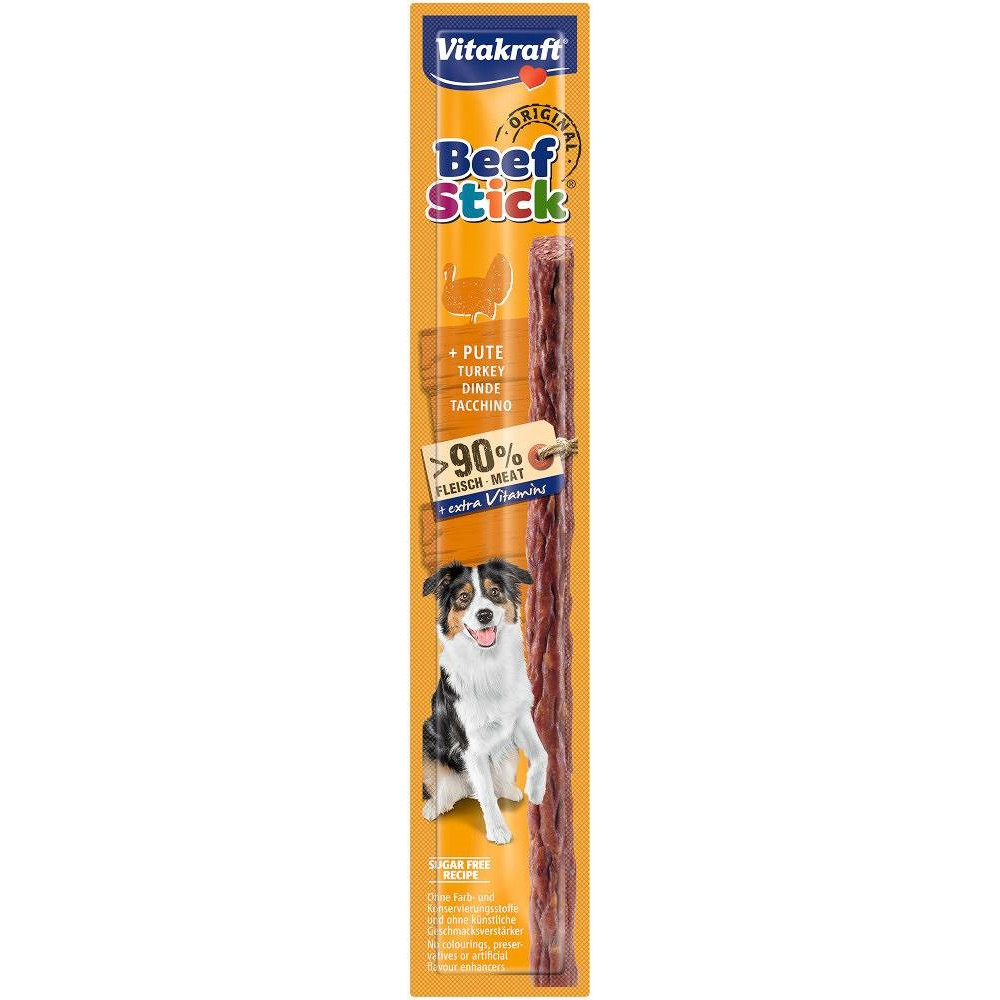 Vitakraft Beef Stick z indykiem, 90% mięsa i pies na pomarańczowym opakowaniu.