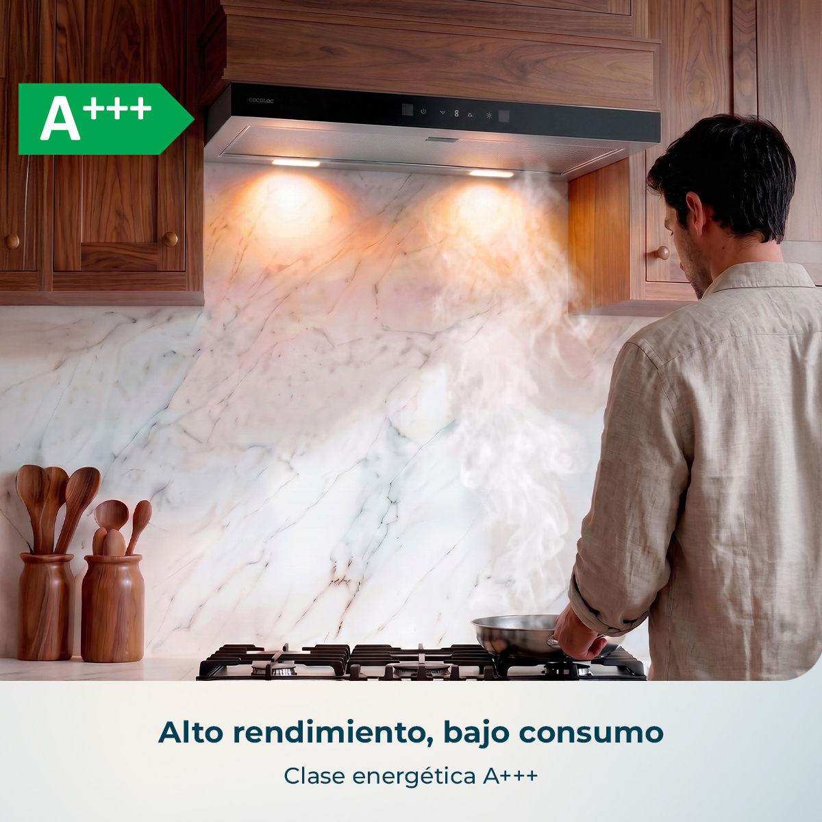 Un hombre cocina en una estufa bajo una campana extractora en una cocina de madera.