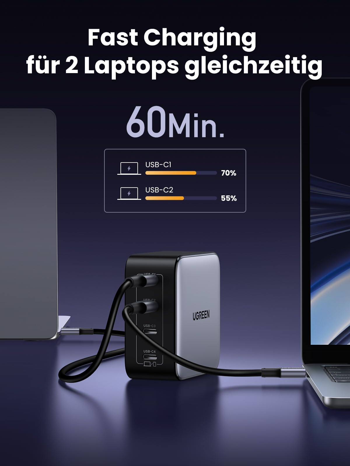 Ugreen-Ladegerät lädt zwei Laptops gleichzeitig auf einem dunklen Hintergrund auf.