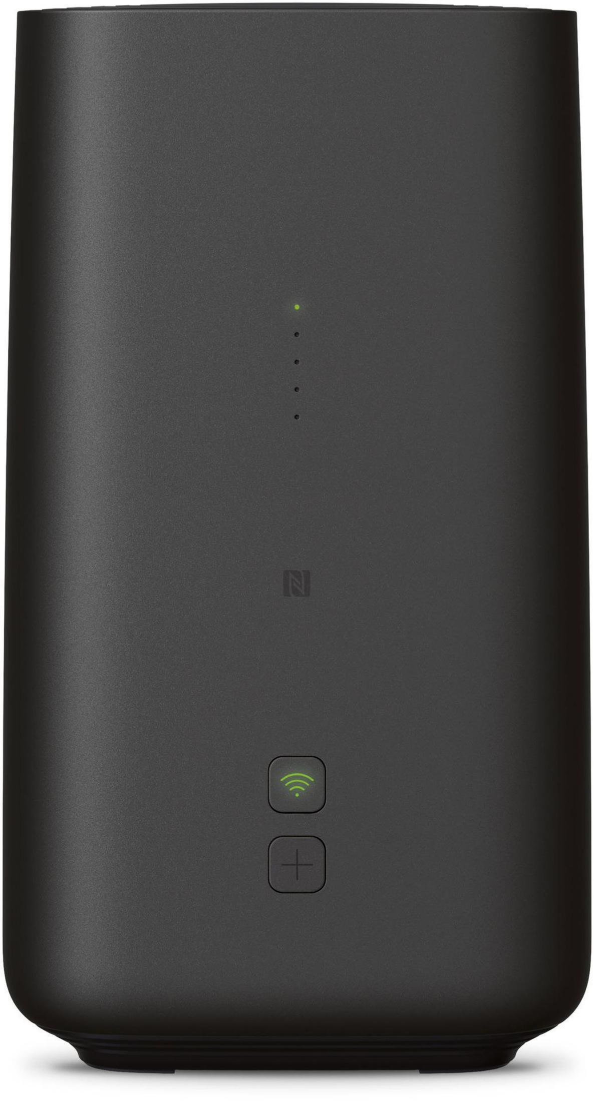 Ein schwarzer zylindrischer Router mit Leuchtanzeigen, NFC-Symbol und Tasten auf der Vorderseite.