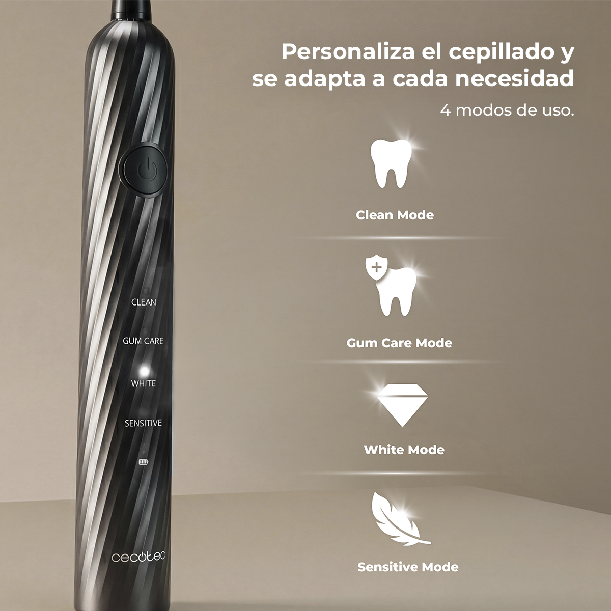 Cepillo de dientes eléctrico negro con diseño en espiral y cuatro modos de uso sobre fondo beis.