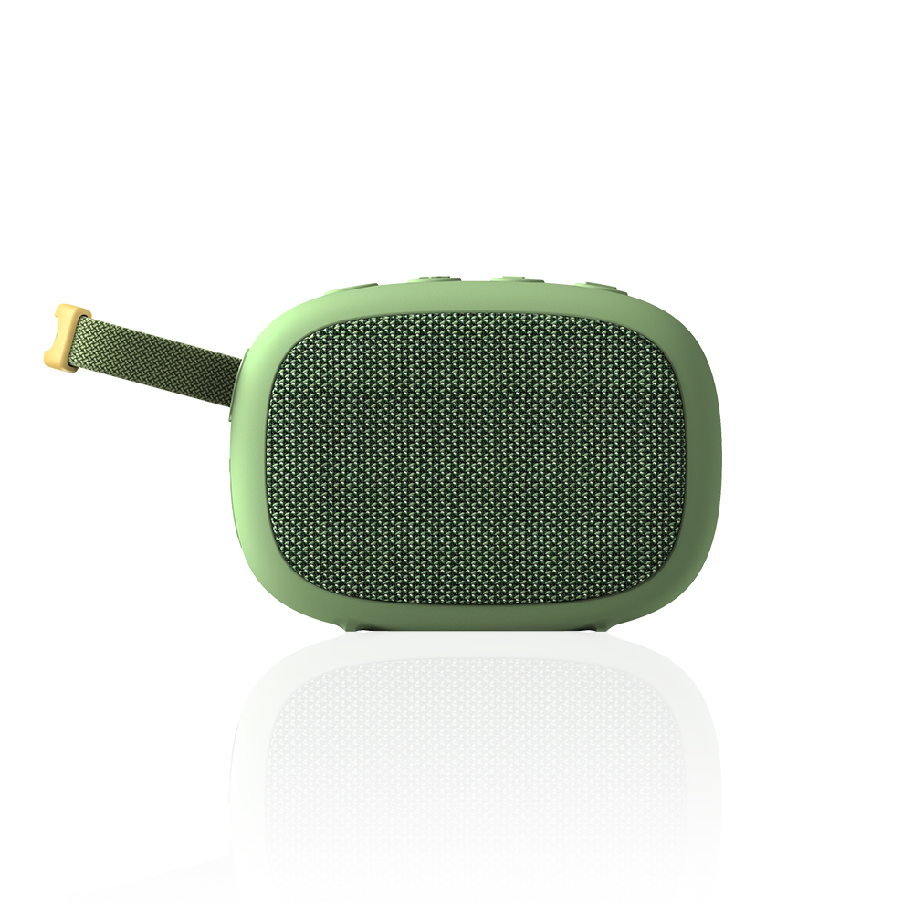 Zielony, owalny głośnik Bluetooth z paskiem na białym tle.