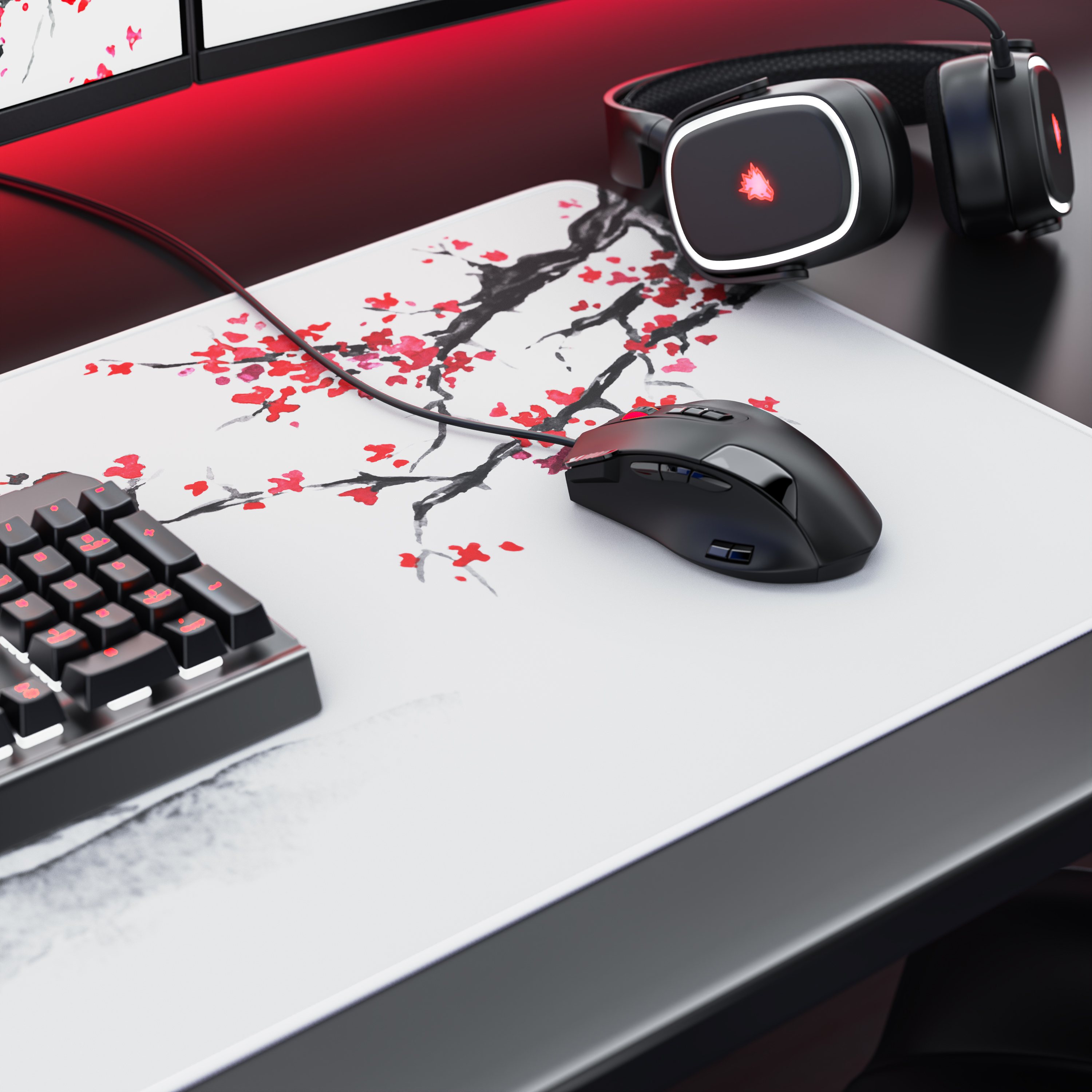 Ein Gaming-Schreibtisch mit Mauspad mit Kirschblütenmotiv, Tastatur, Maus und Kopfhörern.