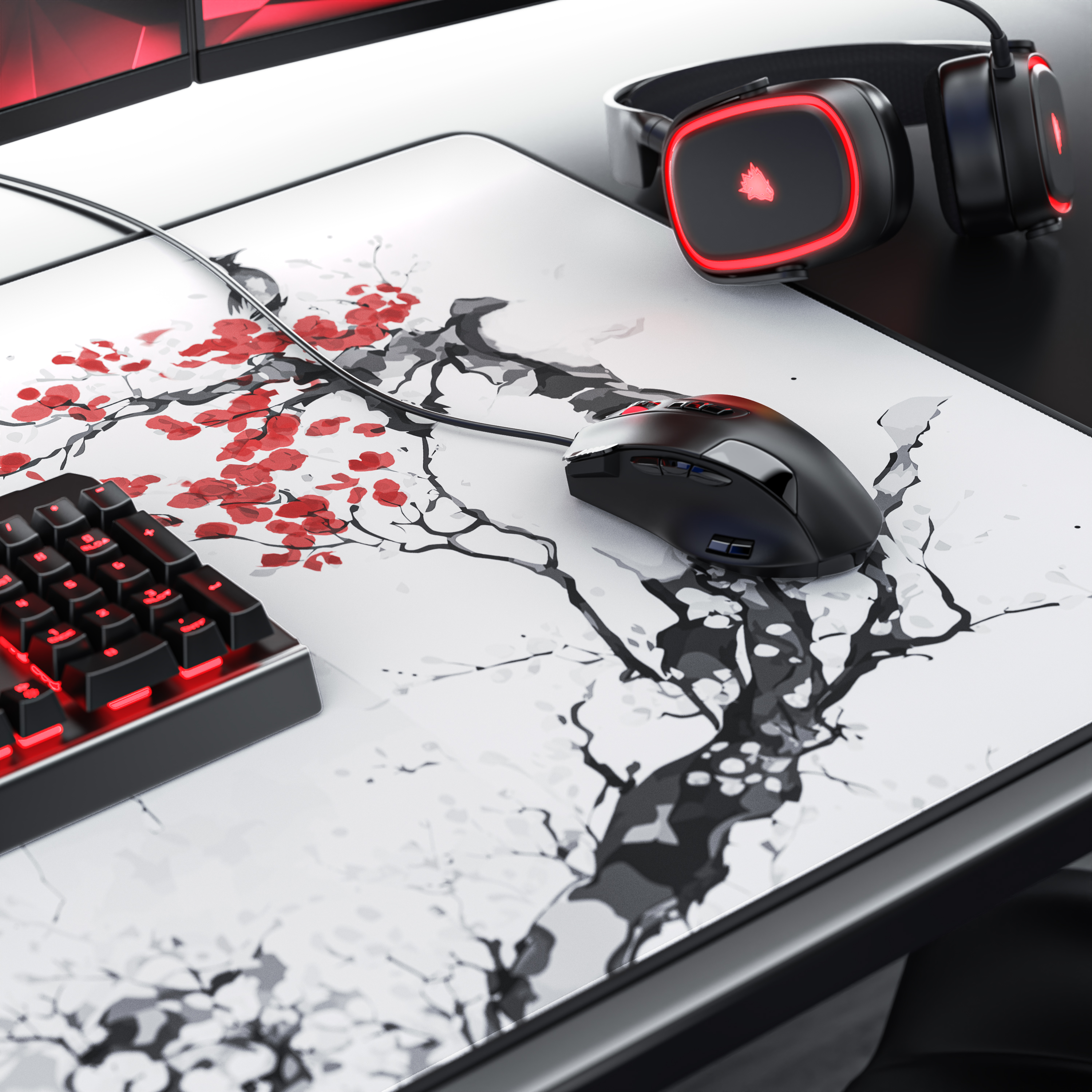 Ein Gaming-Schreibtisch mit Mauspad mit Kirschblütenmuster, schwarzer Maus, Tastatur und rot beleuchteten Kopfhörern.