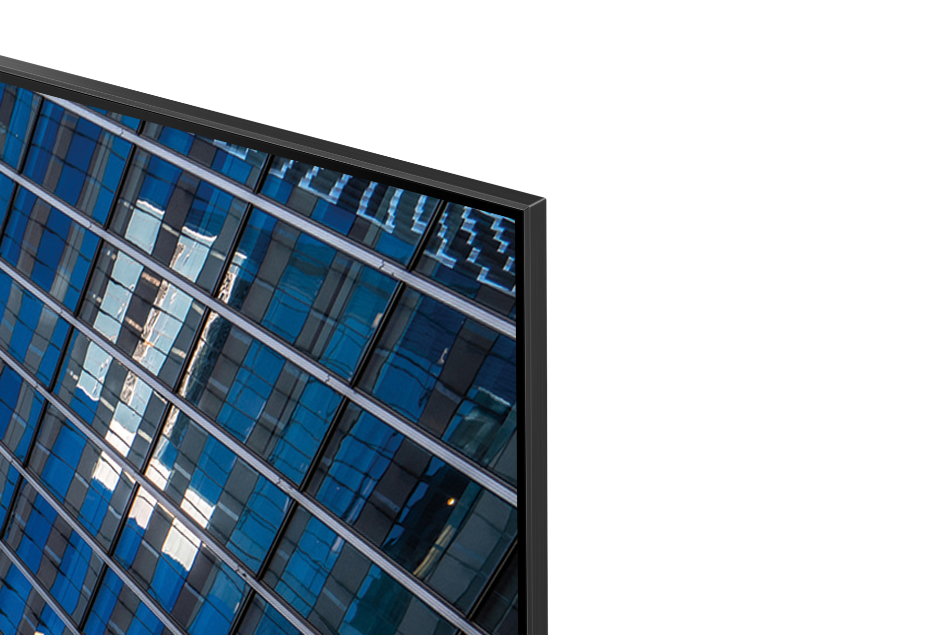 Primer plano de la esquina superior derecha de un televisor plano delgado con un edificio de oficinas azul.