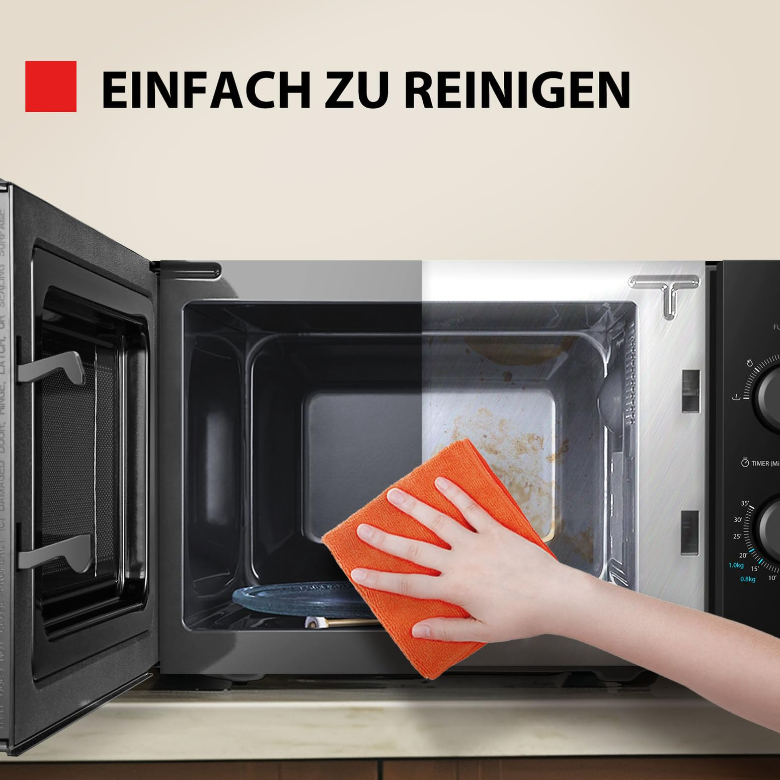 Hand mit orangefarbenem Tuch reinigt schmutzige Mikrowelle; links sauber, rechts schmutzig mit Text Einfach zu reinigen.