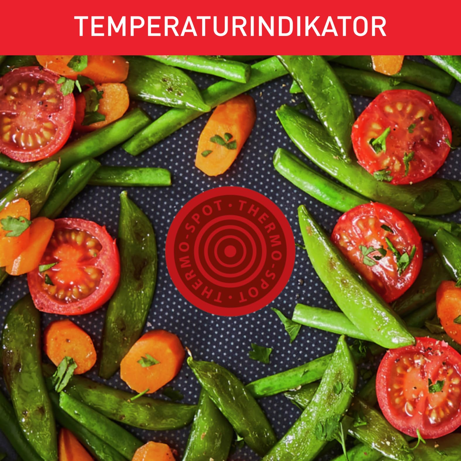 Légumes dans une poêle avec un point thermique rouge au centre.