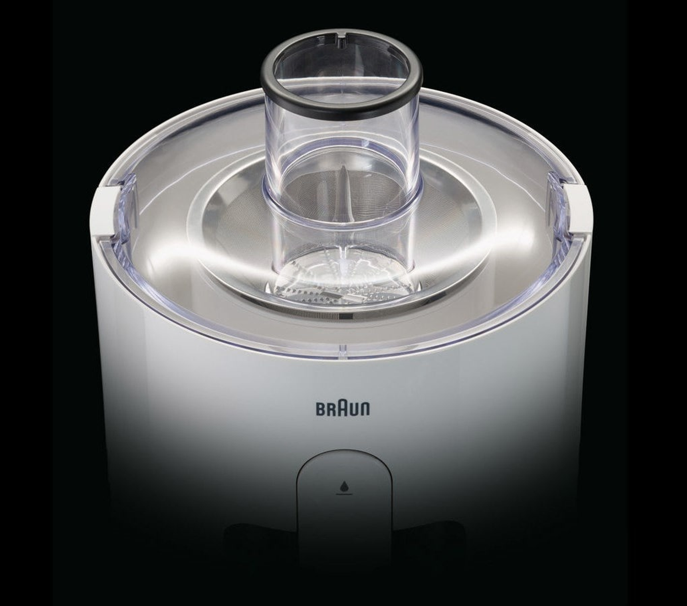 Una vista dall'alto di una centrifuga Braun bianca mostra il tubo di alimentazione, il filtro e il logo.