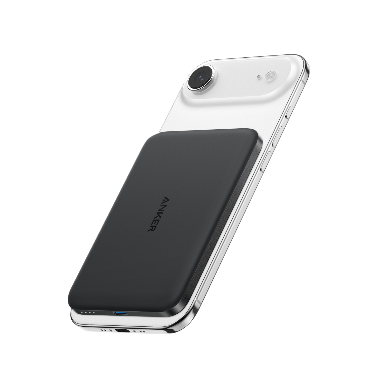 Un power bank Anker nero è attaccato magneticamente al retro di uno smartphone bianco.