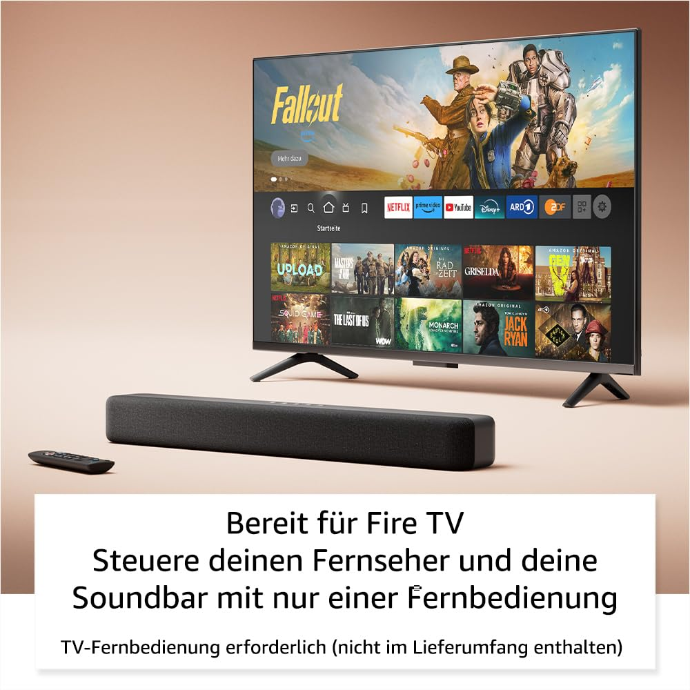 Ein Smart-TV zeigt die Fallout-Serie auf dem Bildschirm, mit einer Soundbar und Fernbedienung davor.
