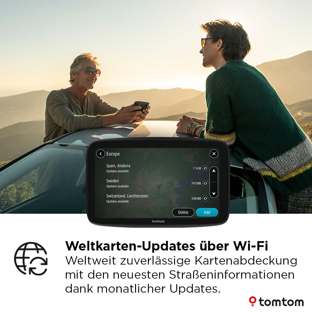 Due persone si appoggiano a un'auto in montagna mentre un navigatore TomTom mostra gli aggiornamenti.