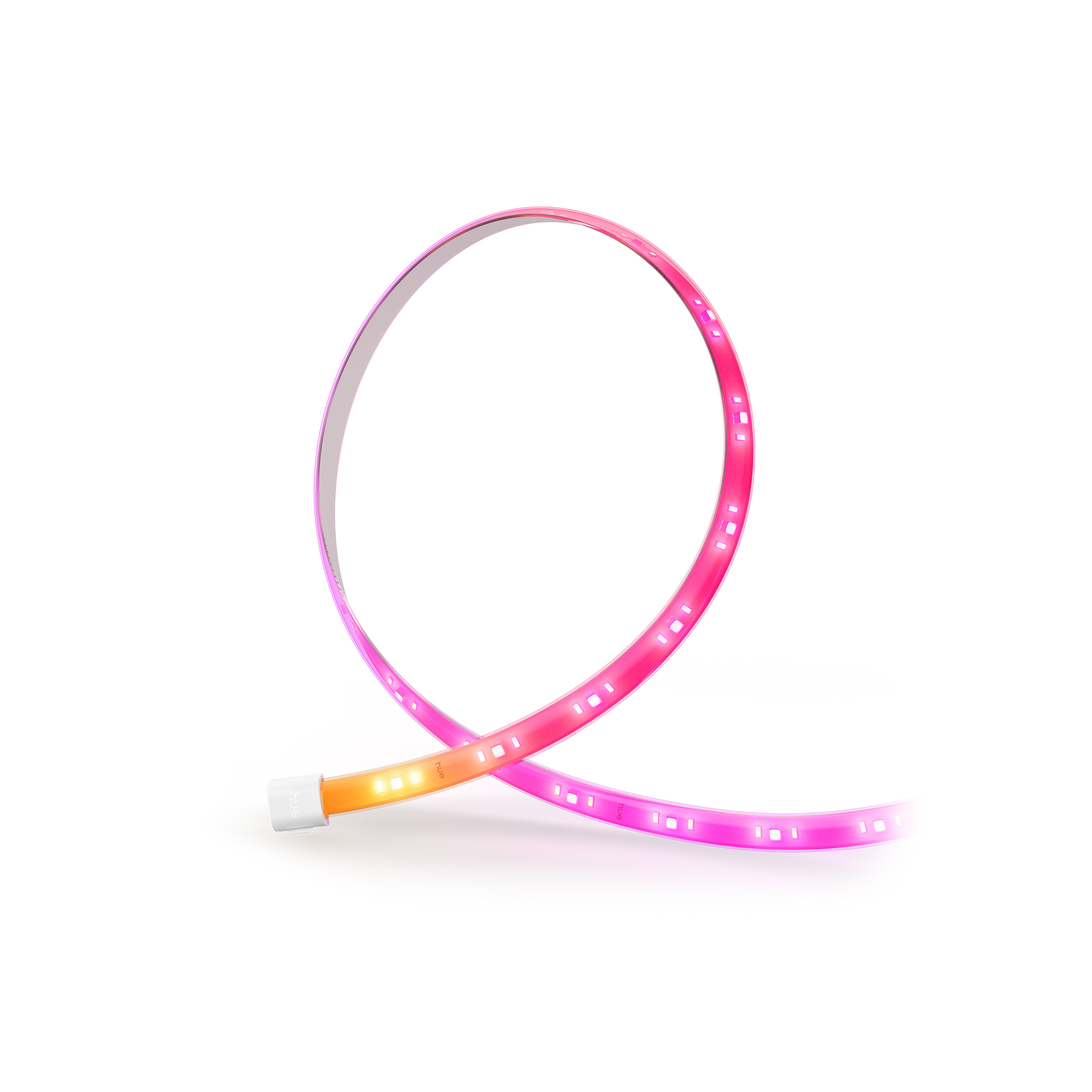 Striscia LED flessibile arrotolata ad anello, con sfumature di colore rosa e giallo su sfondo bianco.