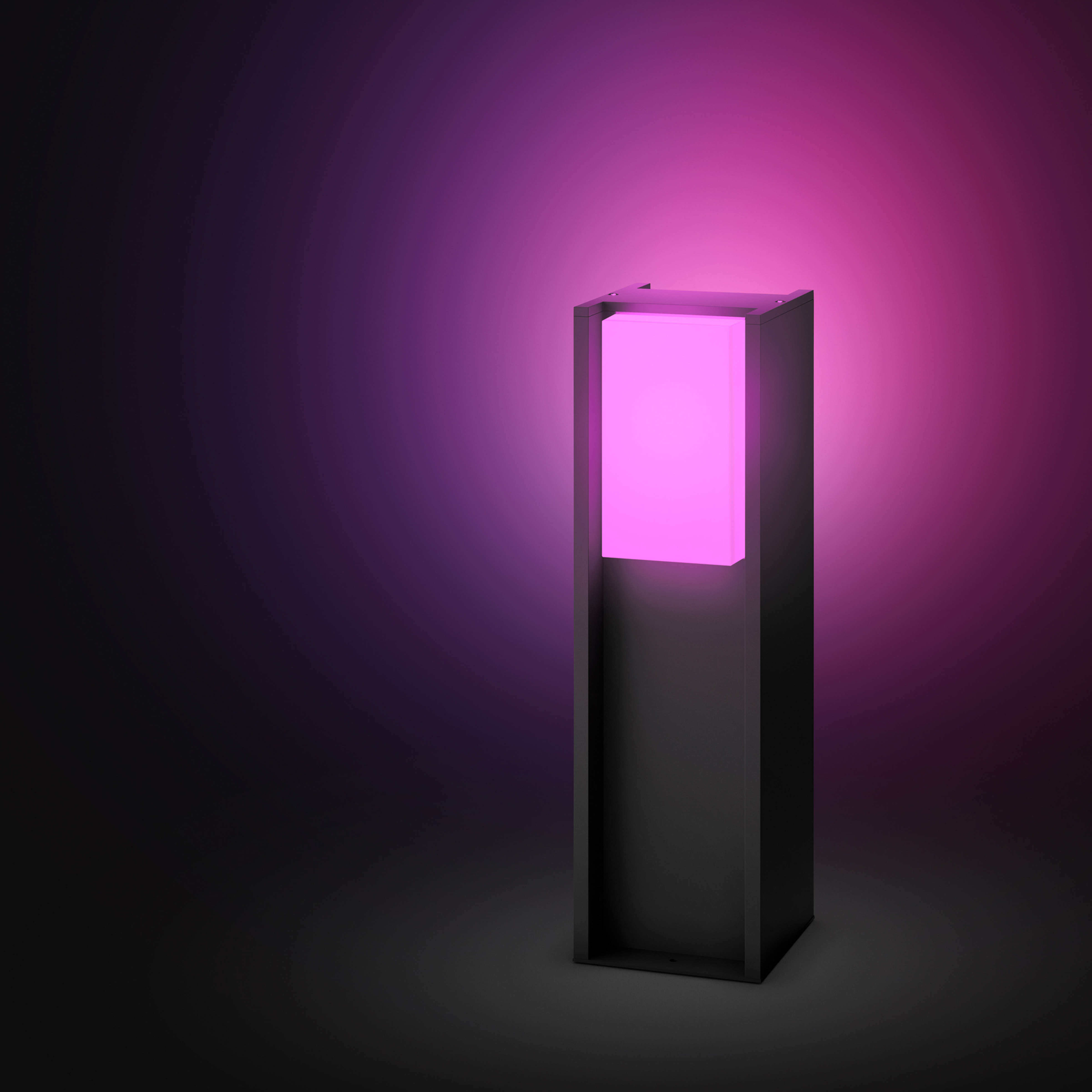 Un moderno paletto luminoso nero emette una luce rosa brillante su sfondo scuro.