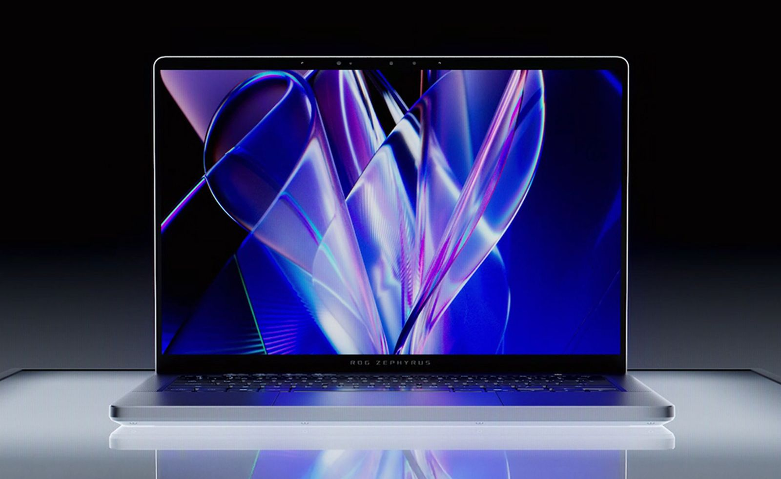 Ein silberner Laptop mit einem bunten, abstrakten Hintergrundbild auf dem Bildschirm.