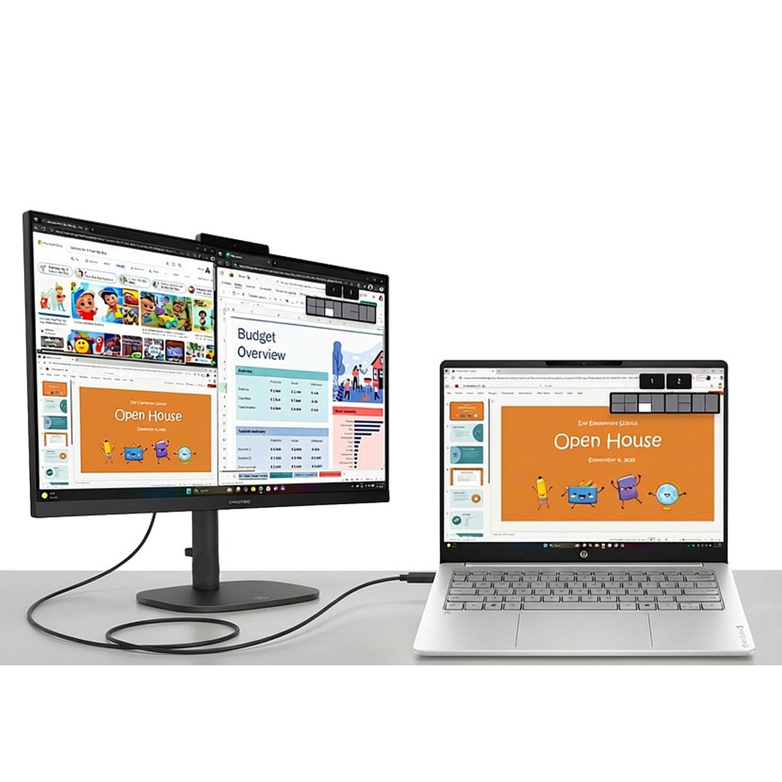 Ein silberner Laptop ist per Kabel mit einem großen Monitor verbunden, der eine Budgetübersicht und geöffnete Fenster zeigt.