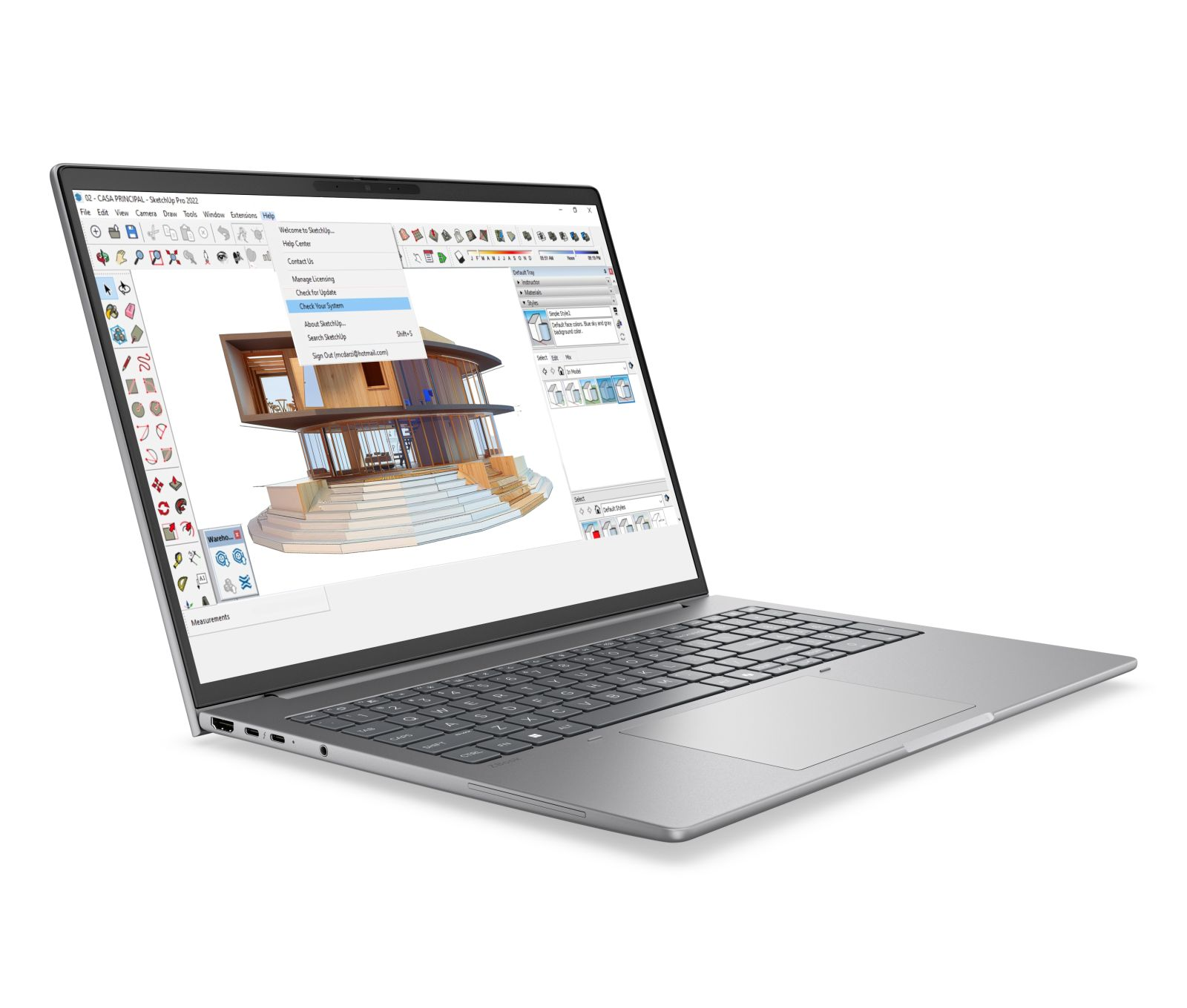 Ein silbernes Laptop zeigt ein 3D-Architekturhausmodell in SketchUp auf dem Bildschirm.