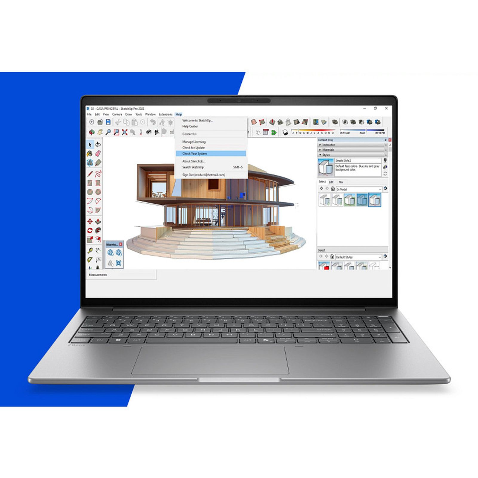 Ein Laptop zeigt auf seinem Bildschirm eine 3D-Architektur-Designsoftware mit einem modernen Hausmodell.