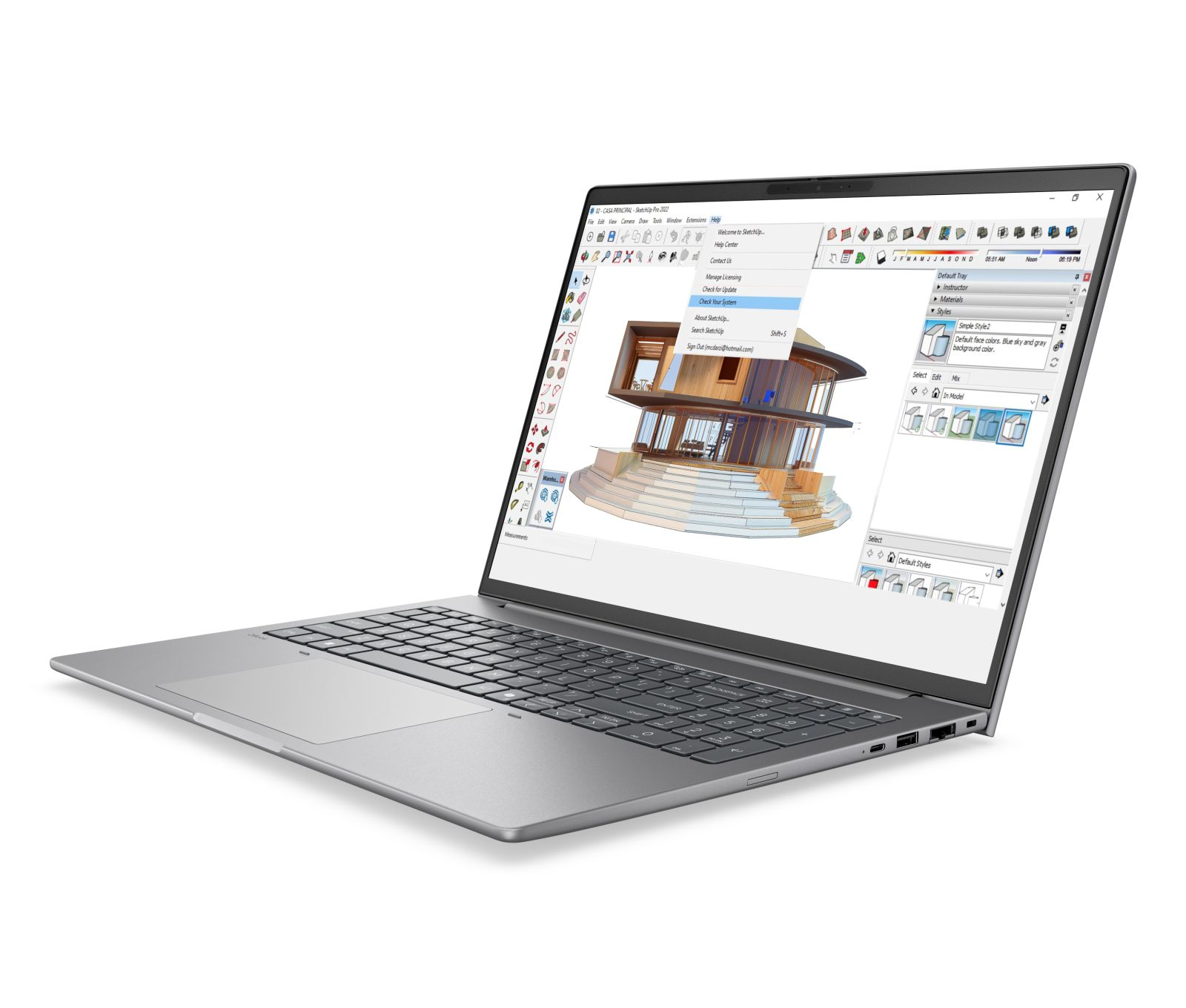 Ein silberner Laptop zeigt 3D-Designsoftware auf dem Bildschirm.