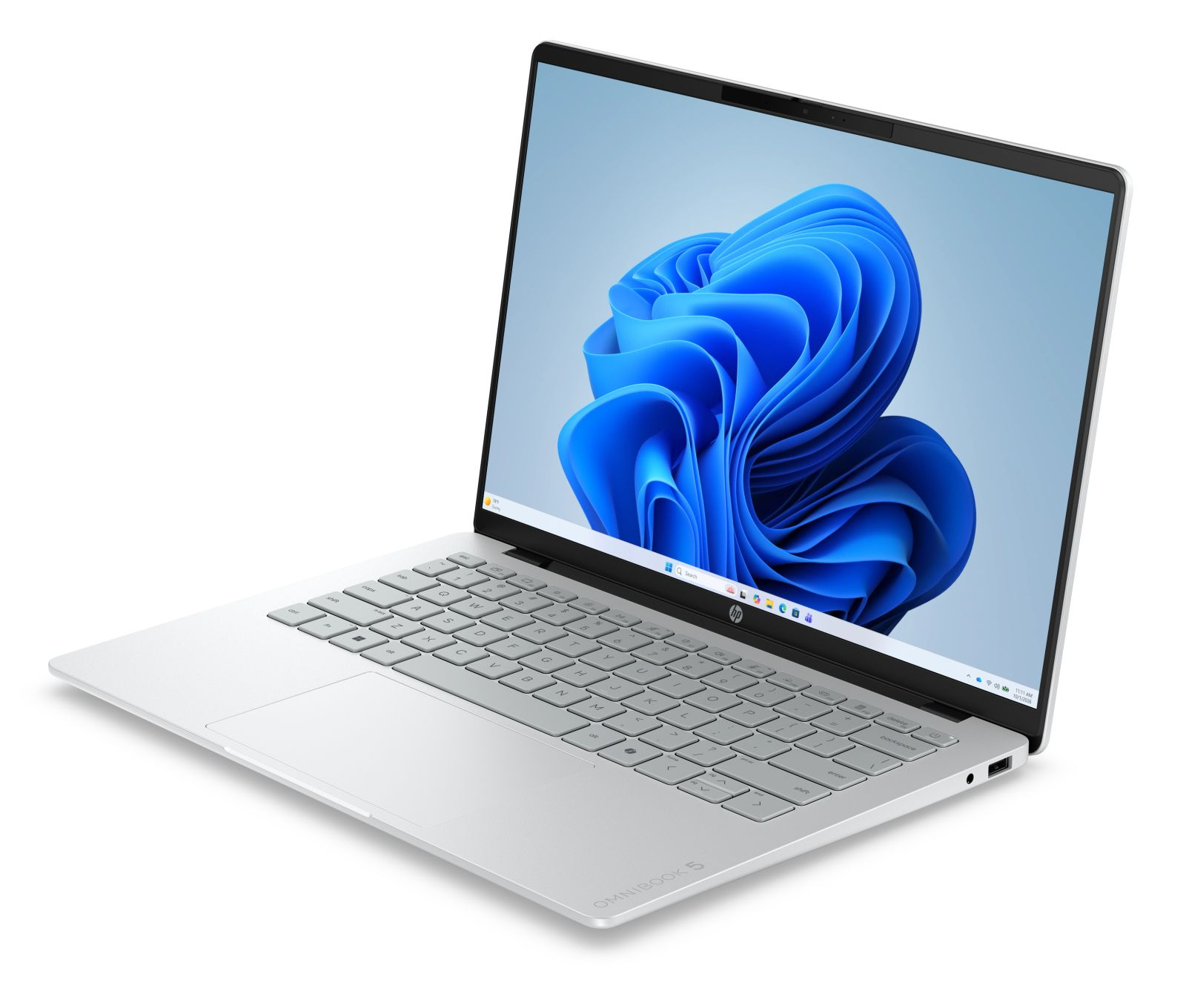 Ein silberner Laptop mit einer weißen Tastatur zeigt einen blauen Hintergrund auf dem Bildschirm.