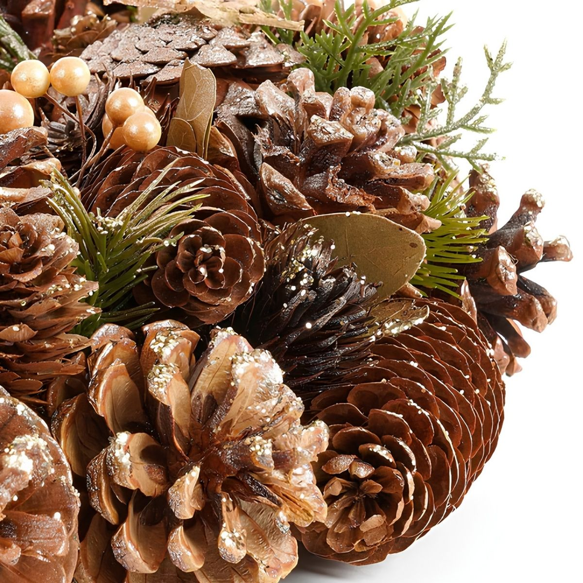 A festive arrangement of various pinecones, green pine needles, and golden berries on a white background.