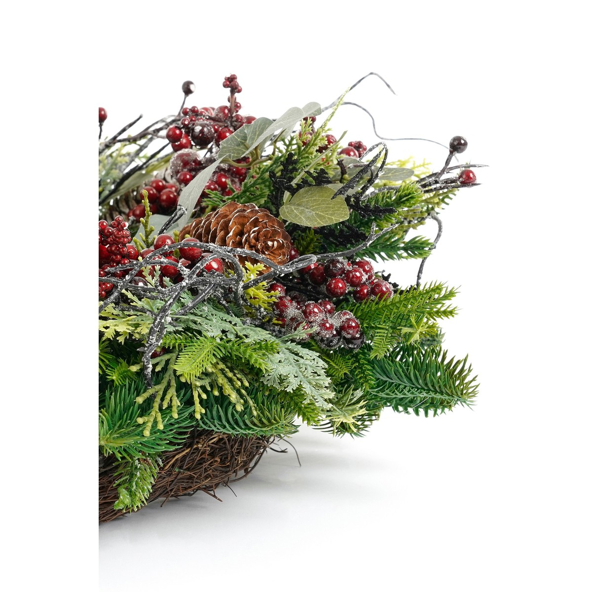 Christmas wreath with green pine, red berries, cones, and branches on white background.