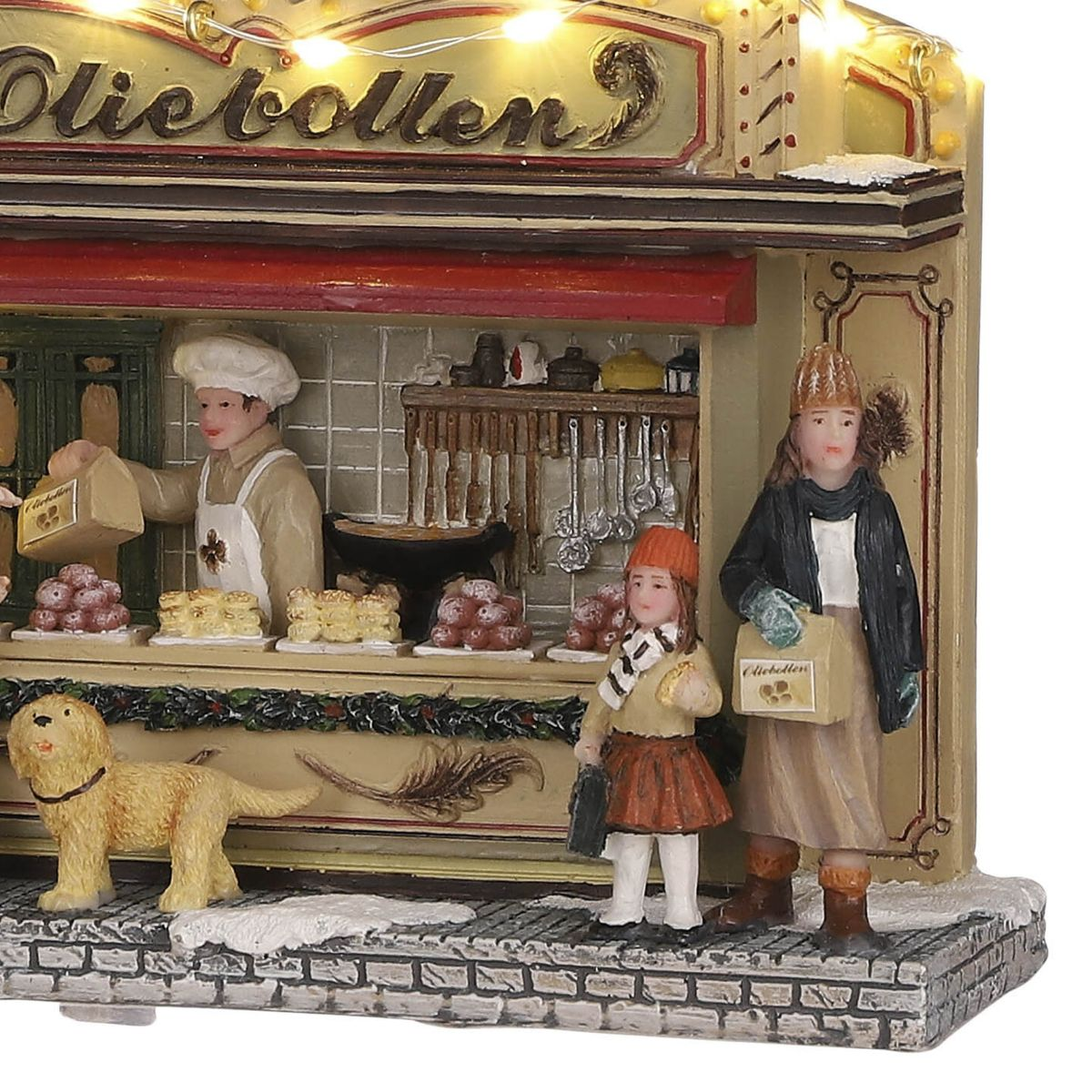 Miniatur-Weihnachtsstand mit Bäcker, zwei Figuren, Hund und Gebäck.