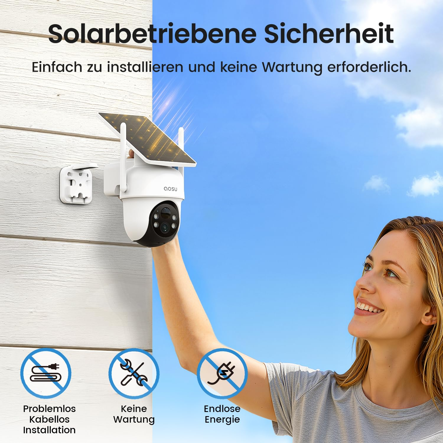 Une femme souriante installe une caméra de sécurité blanche à énergie solaire sur un mur blanc.