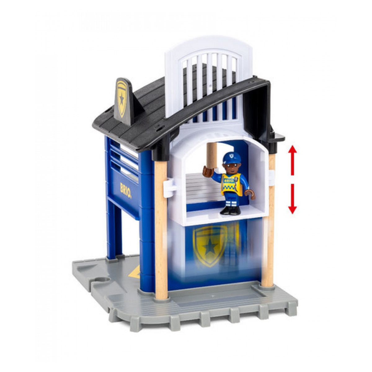 Spielzeug-Polizeistation in Blau und Weiß mit einer Polizistenfigur und Aufzug auf grauer Bodenplatte.