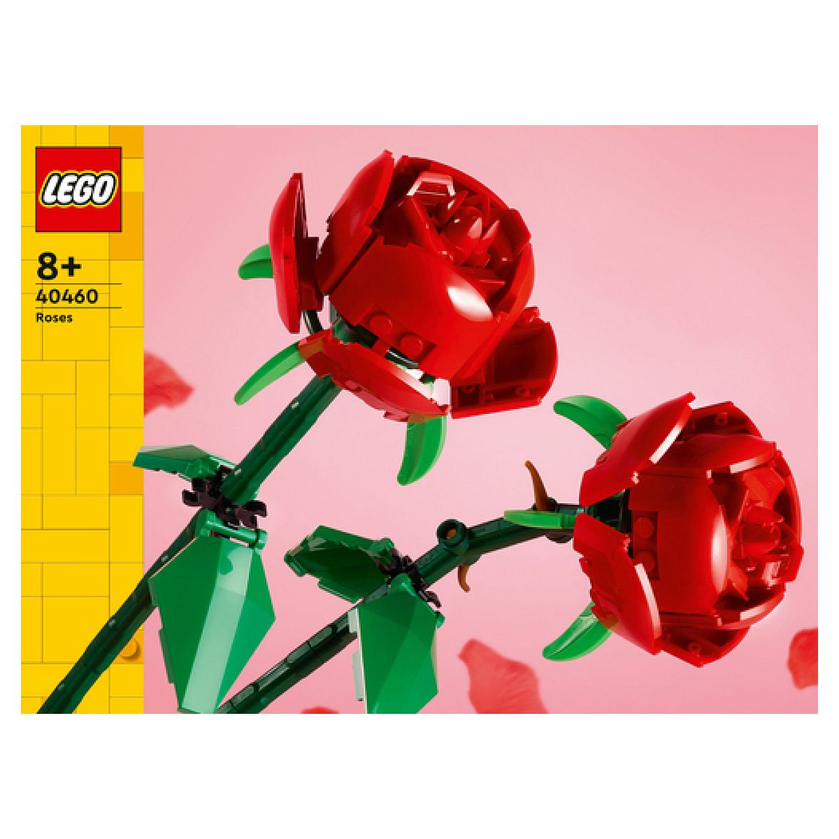 Dos rosas rojas de LEGO con tallos y hojas verdes sobre un fondo rosa.