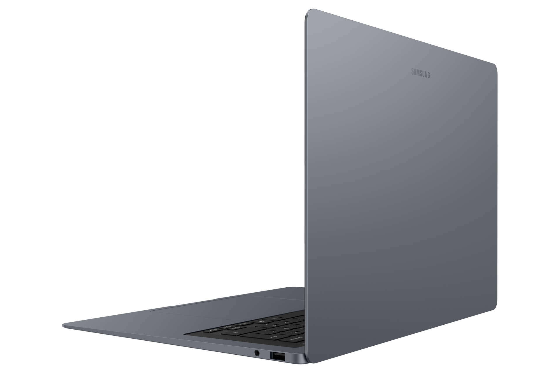 Ein schlanker, grauer Samsung Laptop ist auf einer schwarzen Oberfläche im Querformat platziert.