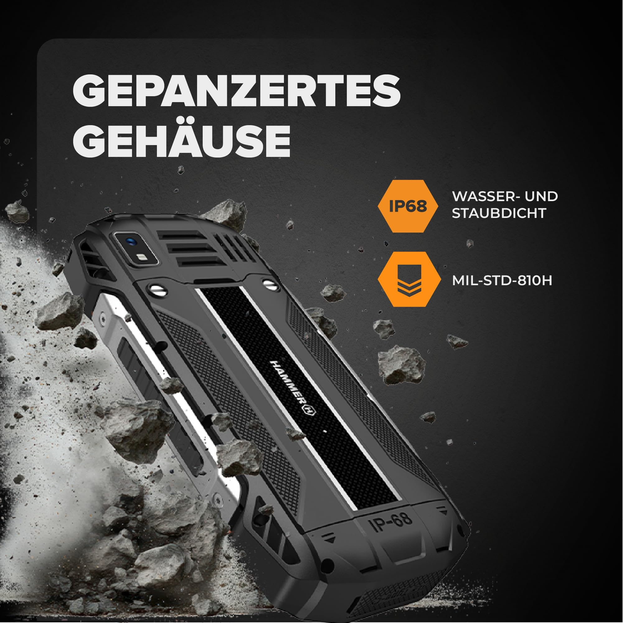 Ein robustes, schwarzes Smartphone von Hammer umgeben von fliegenden Steinen und Staub.